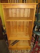 A modern open, honey pine bookcase W 65 cm
