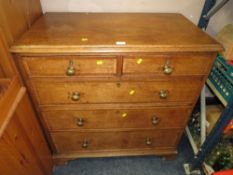 A 19th century Oak cross banded five draw chest of drawers