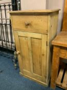 An old pine, single door cupboard with drawer above H 122 cm W 64 cm