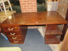 A large Deco style pedestal desk with drawers to one side
