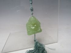 A MODERN JADE BEAD NECKLACE WITH YELLOW METAL MOUNTS, the clasp marked 9K, together with a modern