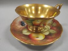A COALPORT SIGNED FRUITS CUP AND SAUCER