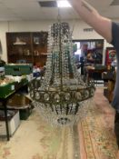 A large empire style crystal and metal modern chandelier