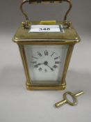 A CARRIAGE CLOCK WITH KEY