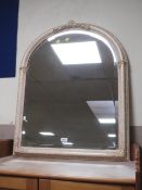 A modern arched cream wall mirror together with an oval gilt example