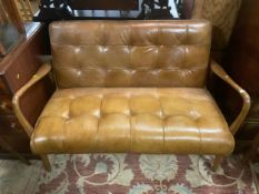 A small modern tan leather brown, two seater settee W 122 cm