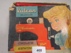 A VINTAGE BOXED VULCAN MINOR CHILDS SEWING MACHINE IN ORIGINAL BOX