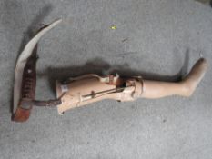 A VINTAGE PROSTHETIC LEG WITH LEATHER WAIST BELT FITTING