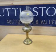 A VINTAGE BRASS OIL LAMP WITH SHADE