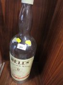 A LARGE EMPTY BELLS SCOTCH WHISKY BOTTLE