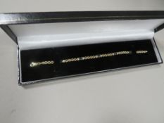 A 10 CARAT GOLD BRACELET SET WITH SAPPHIRES AND DIAMONDS