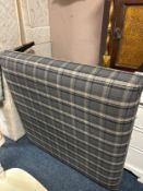 A modern showhome square upholstered stool