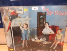 A 20TH CENTURY METAL LAID ON CARD McVITIES ADVERTISING SIGN