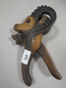 A BLACK FOREST STYLE NUTCRACKER IN THE FORM OF A GOAT COMPLETE WITH GLASS EYES