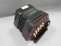 A 19th century J. Wallis patent concertina with rosewood ends