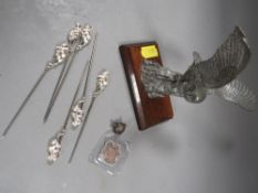 A collection of silver items to include foxes head, owl fob etc