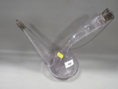 A purple etched wine pourer with white metal mounts