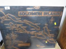 An Oceanic Polynesian New Zealand Maori war club, a copper covered map of the Solomon Islands and