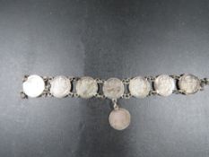 An antique silver three pence's bracelet