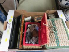 A tray of sewing baskets and contents