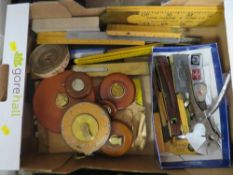 A tray of vintage measuring equipment
