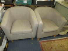 A pair of modern upholstered tub chairs