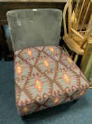 A modern low upholstered bedroom chair