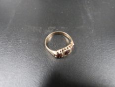 A hallmarked 9 carat gold garnet ring approx weight 2.2 g