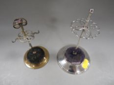 A hallmarked silver hat pin stand stand together with a brass example