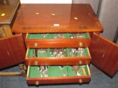 A reproduction mahogany brass inlaid cutlery cabinet with an extensive Webber & Hill plated