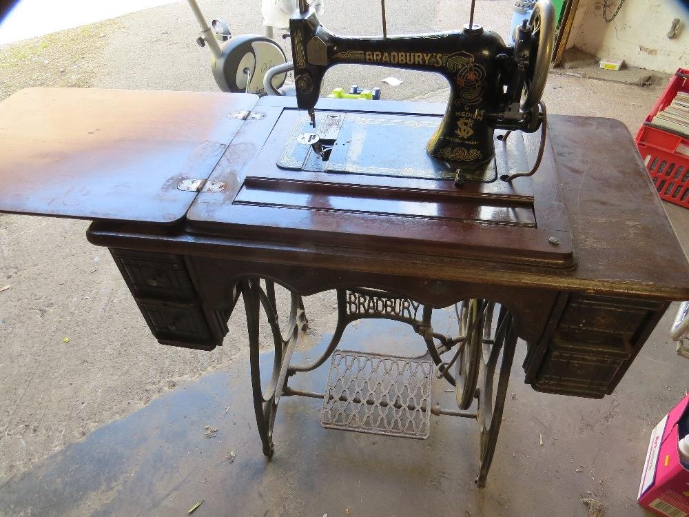 An antique Bradburys sewing machine and cast iron stand