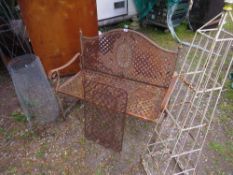 A steel garden bench with cast iron door mat and 2 plant obelisks (bench A/F)