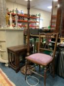 A mahogany lamp standard with a nest of oak tables and an Edwardian chair