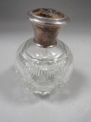 An antique silver pique mounted cut glass scent bottle H.M. London 1928