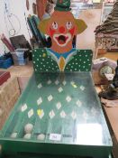 A vintage wooden fairground style game