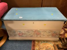 An upholstered pine traditional blanket box