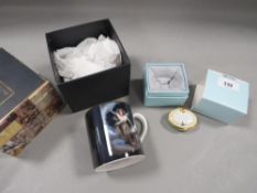 A boxed Halcyon Days 'Happiness is like a Butterfly' trinket box together with a boxed mug