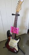 A Westfield Stratocaster three single coil pick up electric guitar in cherry sunburst