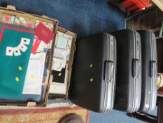 Three graduating vintage suitcases together with a tray of photo frames and a tray of sundries