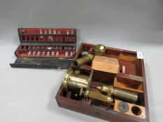 A antique telescope a/f together with a box of small glass bottles containing samples