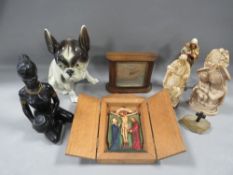 A small collection of religious items including painted plaster figures, a ceramic model bulldog,