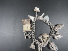 A Silver charm bracelet approx weight 62.7 g