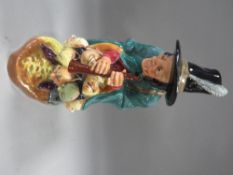 A Royal Doulton figure The Mask Seller