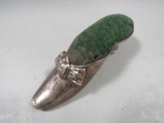 An antique H.M. silver shoe pin cushion Birmingham 1915