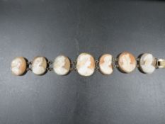A 19th century seven panel cameo bracelet with gilt metal fittings