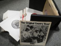 A box of vintage singles to include an autographed 