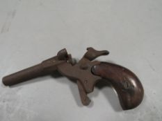 An antique starter pistol a/f