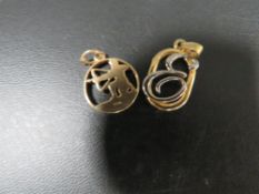 A hallmarked 9 carat gold charm in the form of an archer approx weight 1.8g together with a base