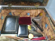 A decorative box containing various collectables