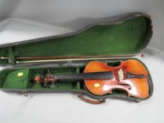 A violin bearing label reading 